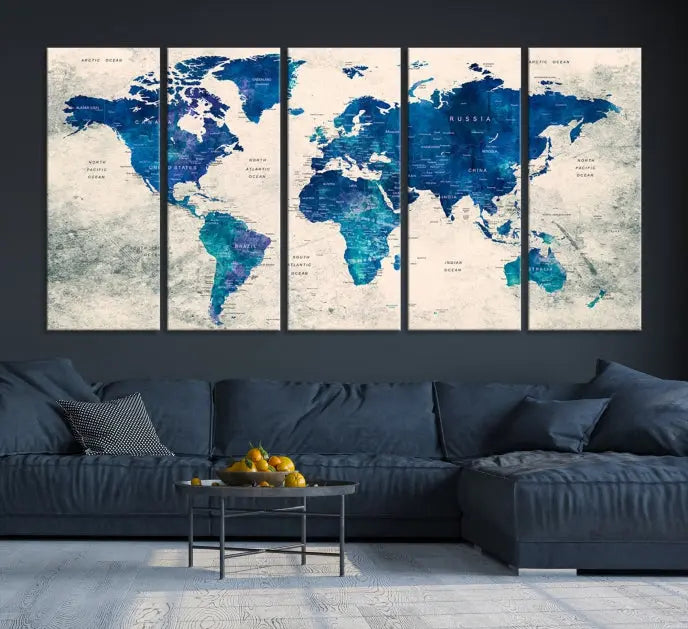 A Navy Blue Push Pin World Map Wall Art Canvas Print, displayed as a triptych on gallery-wrapped, museum-quality canvas, hangs on the wall.