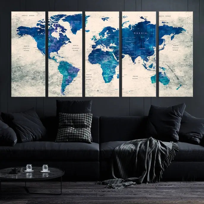 A Navy Blue Push Pin World Map Wall Art Canvas Print, displayed as a triptych on gallery-wrapped, museum-quality canvas, hangs on the wall.