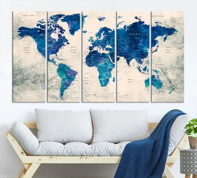 A Navy Blue Push Pin World Map Wall Art Canvas Print, displayed as a triptych on gallery-wrapped, museum-quality canvas, hangs on the wall.