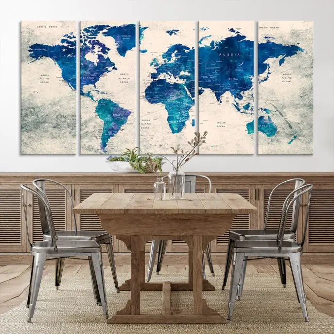 A Navy Blue Push Pin World Map Wall Art Canvas Print, displayed as a triptych on gallery-wrapped, museum-quality canvas, hangs on the wall.