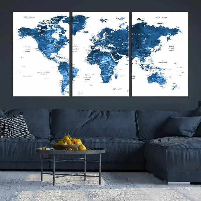 A contemporary living room radiating sophistication showcases the Navy Blue Wall Art World Map Canvas Print, framed and ready to hang.