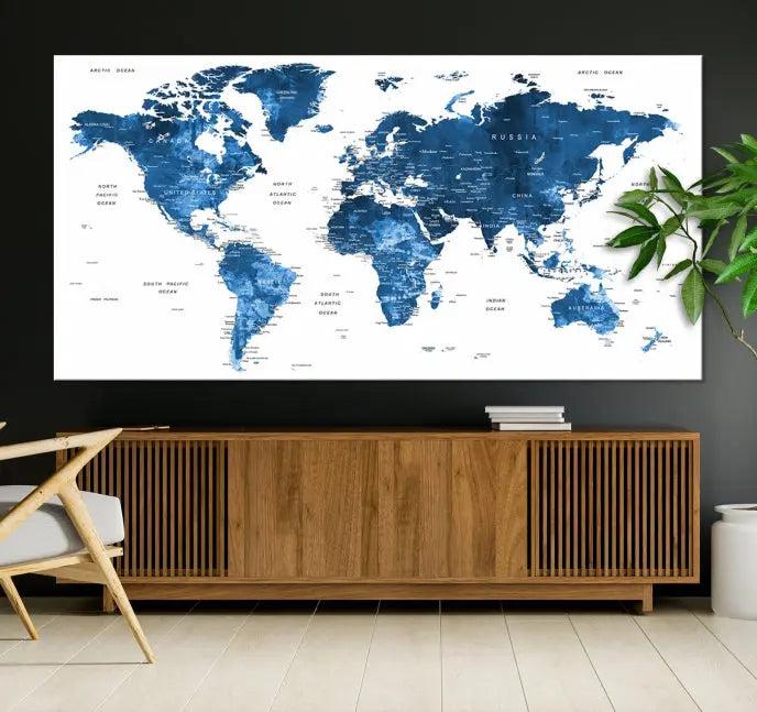 A contemporary living room radiating sophistication showcases the Navy Blue Wall Art World Map Canvas Print, framed and ready to hang.