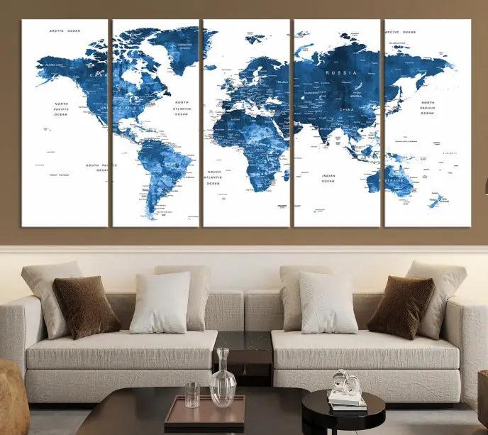 A contemporary living room radiating sophistication showcases the Navy Blue Wall Art World Map Canvas Print, framed and ready to hang.