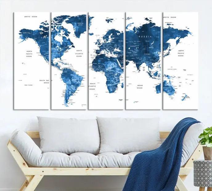 A contemporary living room radiating sophistication showcases the Navy Blue Wall Art World Map Canvas Print, framed and ready to hang.