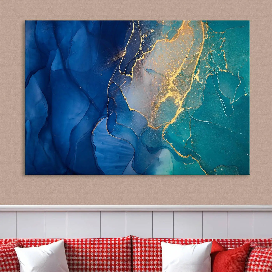 A Navy Blue and Green Marble Fluid Effect Wall Art Abstract Canvas Wall Art Print, featuring captivating patterns of blue and teal hues interlaced with gold veining, is ready to hang and protected by a UV-coating to preserve its vibrant colors over time.