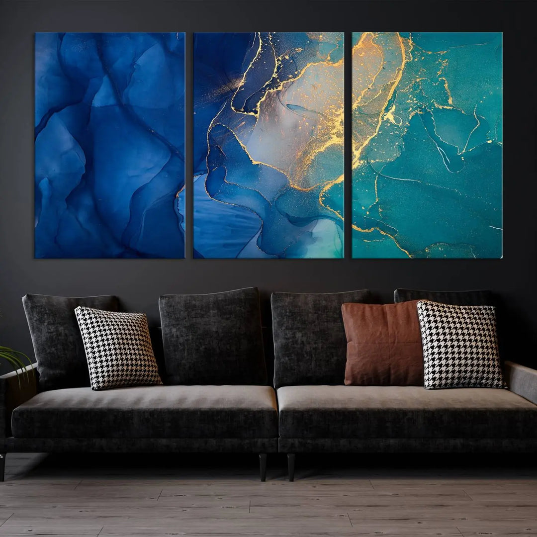 A Navy Blue and Green Marble Fluid Effect Wall Art Abstract Canvas Wall Art Print, featuring captivating patterns of blue and teal hues interlaced with gold veining, is ready to hang and protected by a UV-coating to preserve its vibrant colors over time.