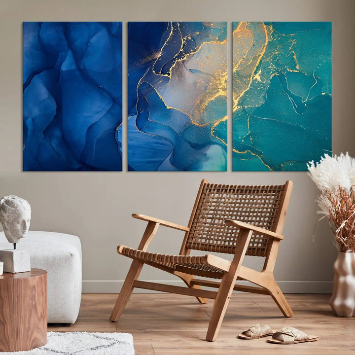 A Navy Blue and Green Marble Fluid Effect Wall Art Abstract Canvas Wall Art Print, featuring captivating patterns of blue and teal hues interlaced with gold veining, is ready to hang and protected by a UV-coating to preserve its vibrant colors over time.