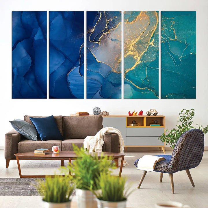 A Navy Blue and Green Marble Fluid Effect Wall Art Abstract Canvas Wall Art Print, featuring captivating patterns of blue and teal hues interlaced with gold veining, is ready to hang and protected by a UV-coating to preserve its vibrant colors over time.