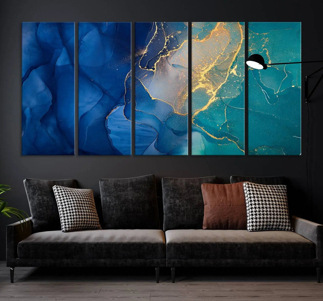 A Navy Blue and Green Marble Fluid Effect Wall Art Abstract Canvas Wall Art Print, featuring captivating patterns of blue and teal hues interlaced with gold veining, is ready to hang and protected by a UV-coating to preserve its vibrant colors over time.