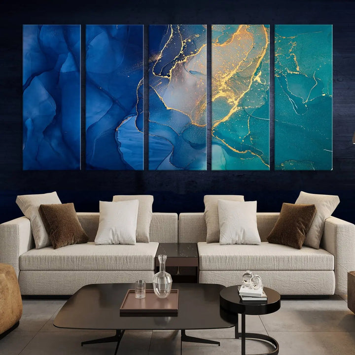 A Navy Blue and Green Marble Fluid Effect Wall Art Abstract Canvas Wall Art Print, featuring captivating patterns of blue and teal hues interlaced with gold veining, is ready to hang and protected by a UV-coating to preserve its vibrant colors over time.