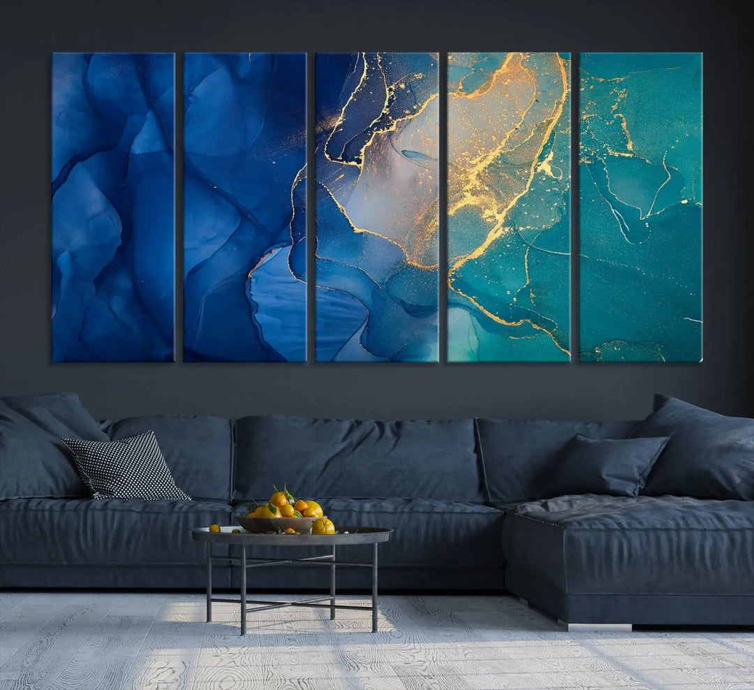 A Navy Blue and Green Marble Fluid Effect Wall Art Abstract Canvas Wall Art Print, featuring captivating patterns of blue and teal hues interlaced with gold veining, is ready to hang and protected by a UV-coating to preserve its vibrant colors over time.