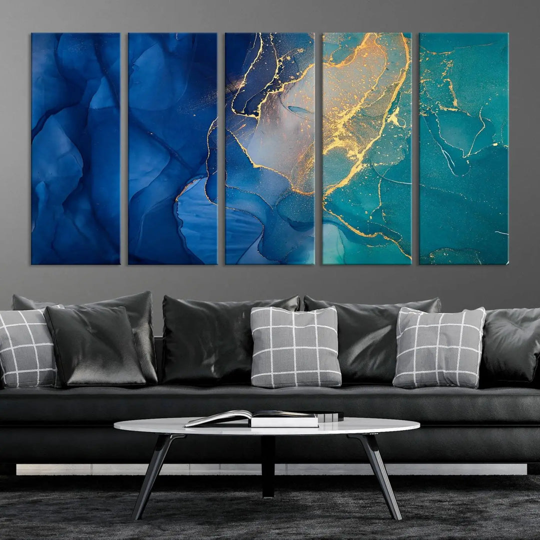 A Navy Blue and Green Marble Fluid Effect Wall Art Abstract Canvas Wall Art Print, featuring captivating patterns of blue and teal hues interlaced with gold veining, is ready to hang and protected by a UV-coating to preserve its vibrant colors over time.