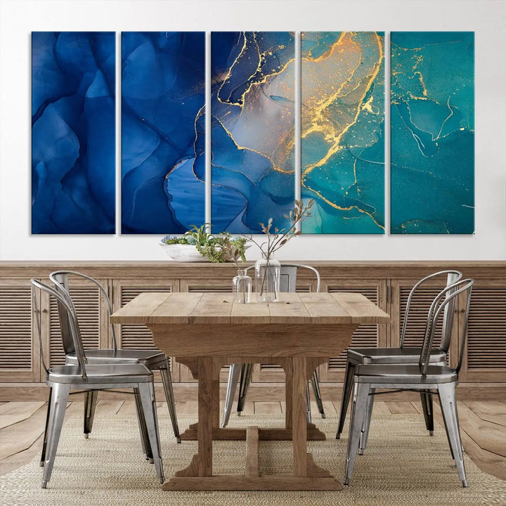 A Navy Blue and Green Marble Fluid Effect Wall Art Abstract Canvas Wall Art Print, featuring captivating patterns of blue and teal hues interlaced with gold veining, is ready to hang and protected by a UV-coating to preserve its vibrant colors over time.