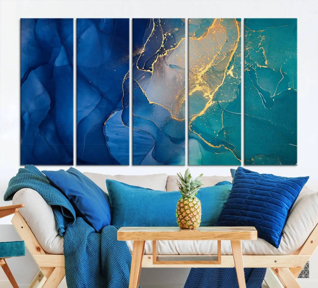 A Navy Blue and Green Marble Fluid Effect Wall Art Abstract Canvas Wall Art Print, featuring captivating patterns of blue and teal hues interlaced with gold veining, is ready to hang and protected by a UV-coating to preserve its vibrant colors over time.