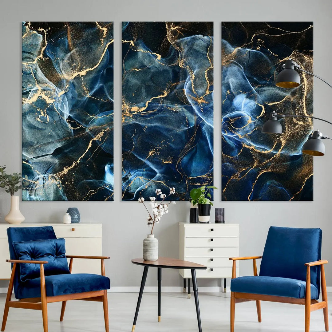 The Navy Blue and Smokey Marble Fluid Effect Abstract Canvas Wall Art Print features a swirling blue and gold pattern in a gallery-wrapped, museum-quality design.