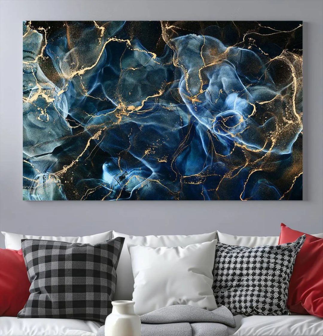 The Navy Blue and Smokey Marble Fluid Effect Abstract Canvas Wall Art Print features a swirling blue and gold pattern in a gallery-wrapped, museum-quality design.