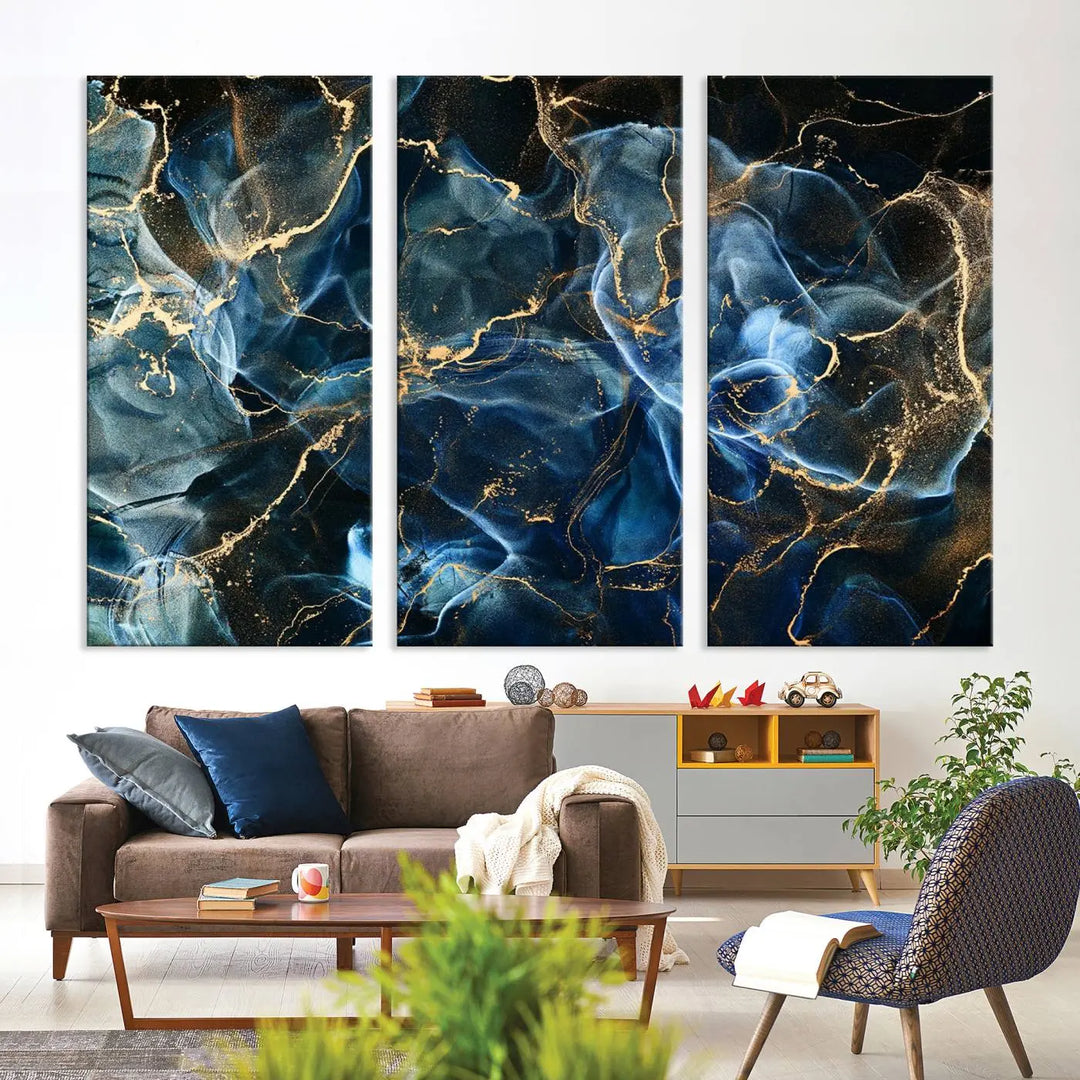 The Navy Blue and Smokey Marble Fluid Effect Abstract Canvas Wall Art Print features a swirling blue and gold pattern in a gallery-wrapped, museum-quality design.