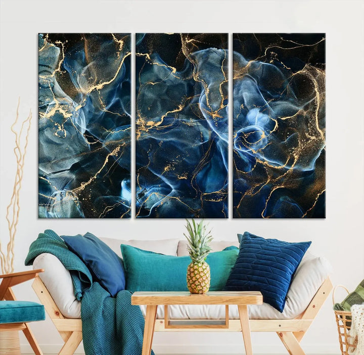 The Navy Blue and Smokey Marble Fluid Effect Abstract Canvas Wall Art Print features a swirling blue and gold pattern in a gallery-wrapped, museum-quality design.