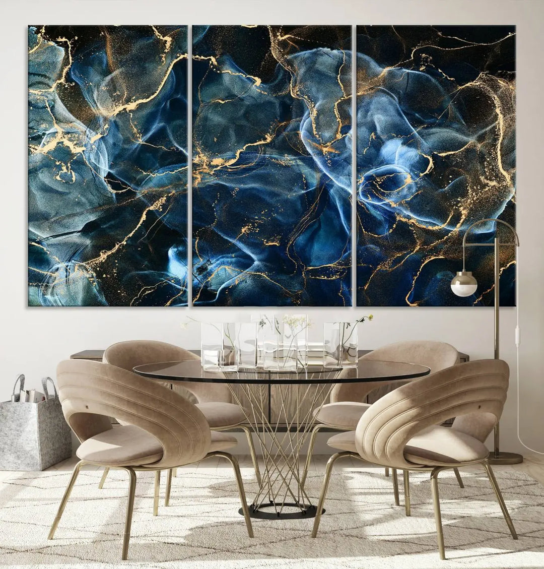 The Navy Blue and Smokey Marble Fluid Effect Abstract Canvas Wall Art Print features a swirling blue and gold pattern in a gallery-wrapped, museum-quality design.