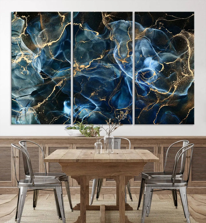 The Navy Blue and Smokey Marble Fluid Effect Abstract Canvas Wall Art Print features a swirling blue and gold pattern in a gallery-wrapped, museum-quality design.