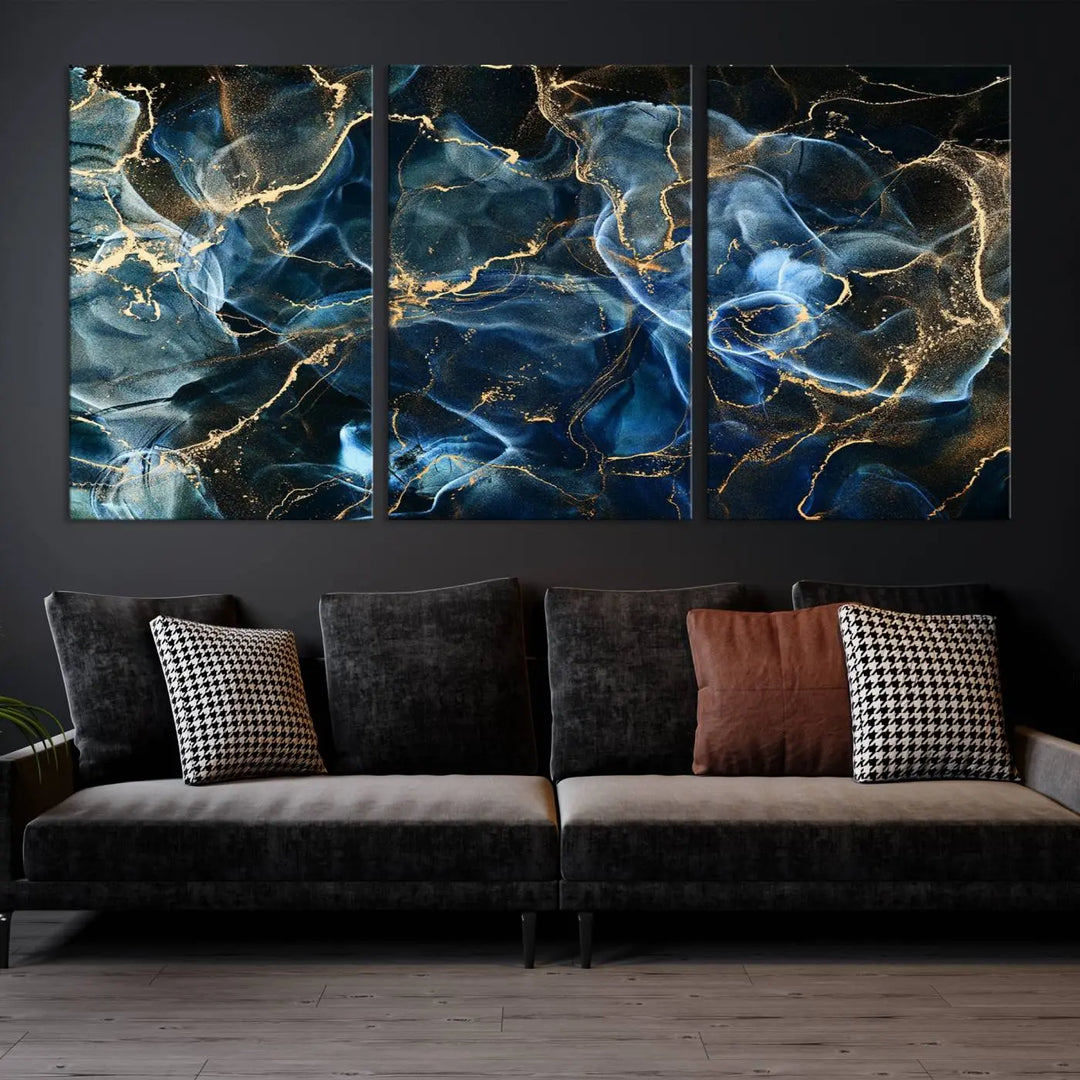 The Navy Blue and Smokey Marble Fluid Effect Abstract Canvas Wall Art Print features a swirling blue and gold pattern in a gallery-wrapped, museum-quality design.