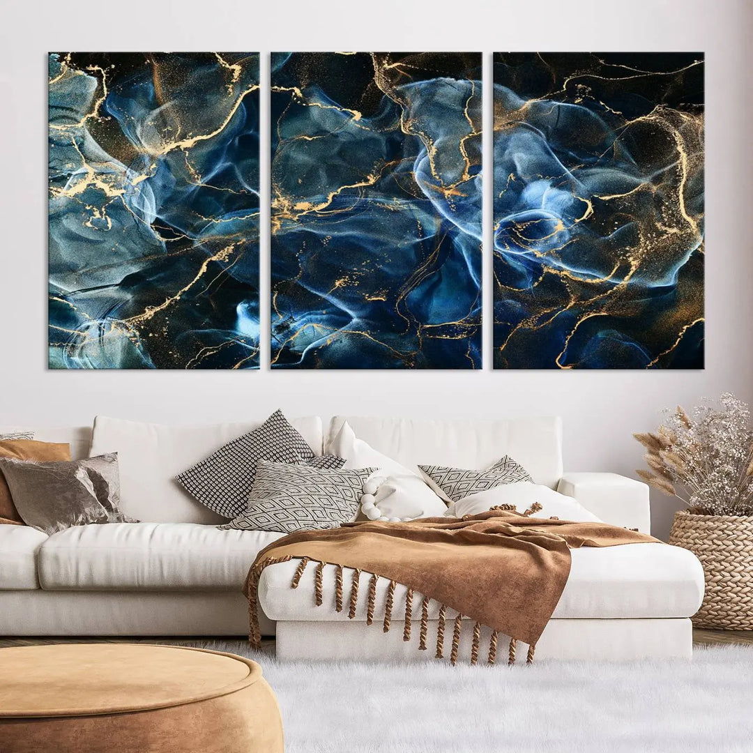 The Navy Blue and Smokey Marble Fluid Effect Abstract Canvas Wall Art Print features a swirling blue and gold pattern in a gallery-wrapped, museum-quality design.