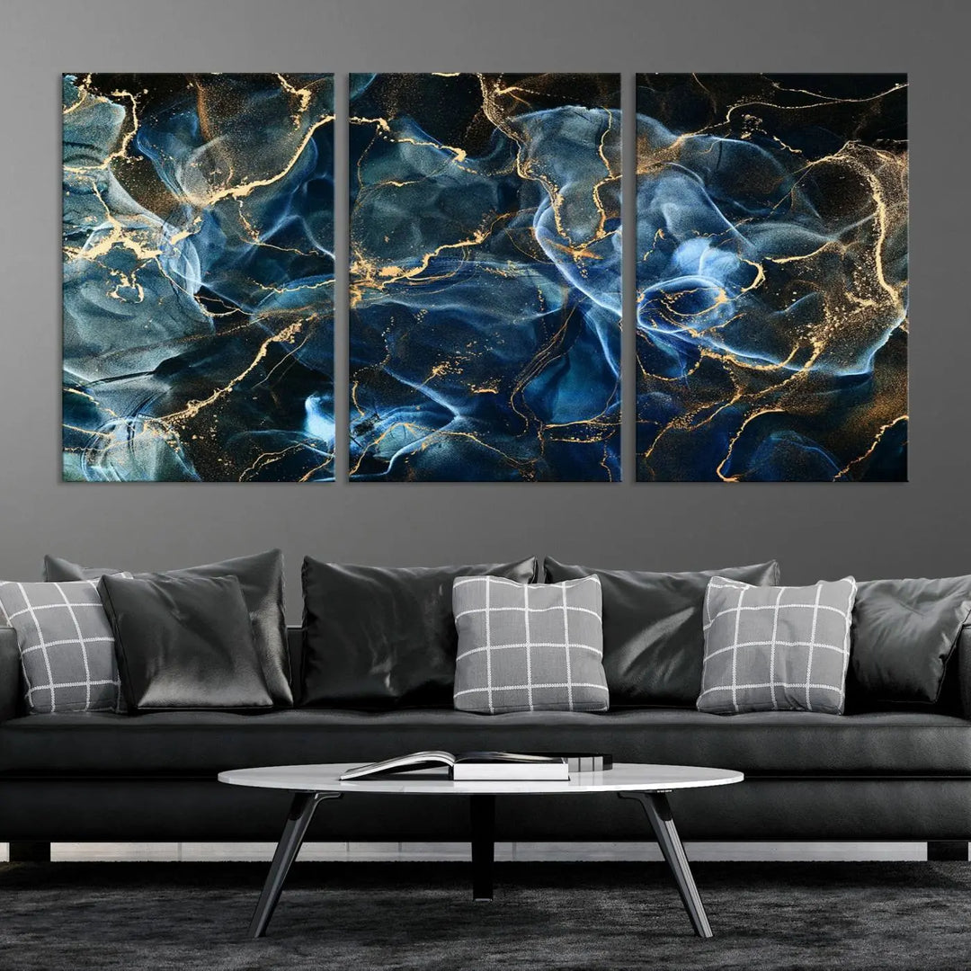 The Navy Blue and Smokey Marble Fluid Effect Abstract Canvas Wall Art Print features a swirling blue and gold pattern in a gallery-wrapped, museum-quality design.