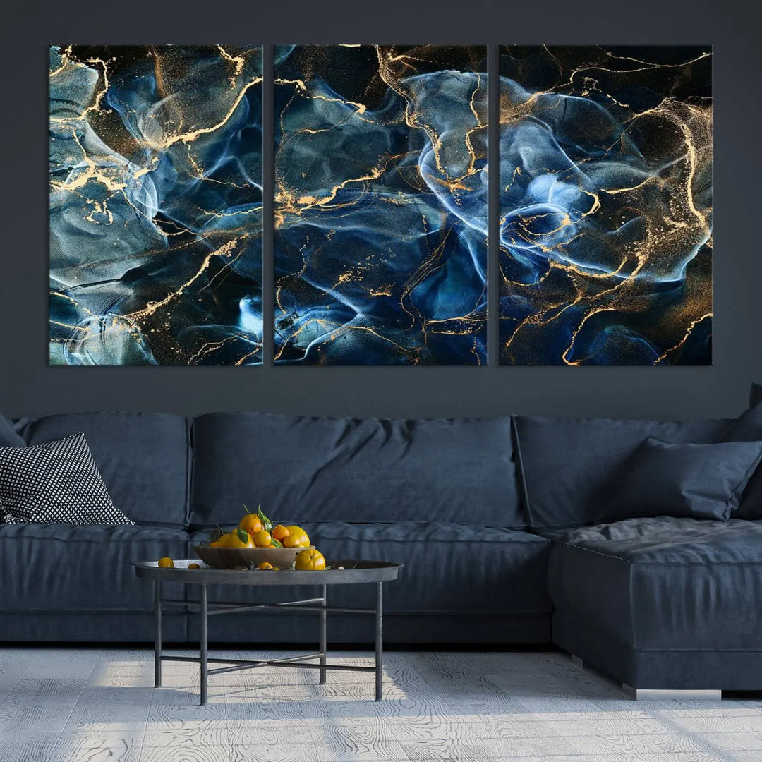 The Navy Blue and Smokey Marble Fluid Effect Abstract Canvas Wall Art Print features a swirling blue and gold pattern in a gallery-wrapped, museum-quality design.