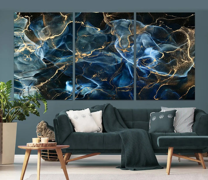 The Navy Blue and Smokey Marble Fluid Effect Abstract Canvas Wall Art Print features a swirling blue and gold pattern in a gallery-wrapped, museum-quality design.