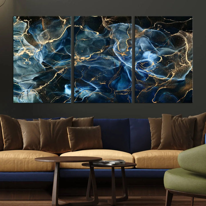 The Navy Blue and Smokey Marble Fluid Effect Abstract Canvas Wall Art Print features a swirling blue and gold pattern in a gallery-wrapped, museum-quality design.