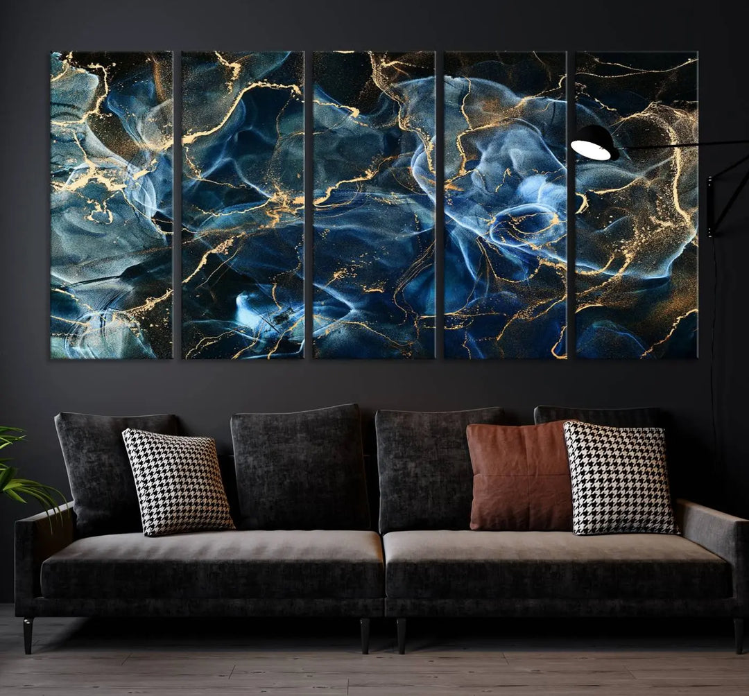 The Navy Blue and Smokey Marble Fluid Effect Abstract Canvas Wall Art Print features a swirling blue and gold pattern in a gallery-wrapped, museum-quality design.