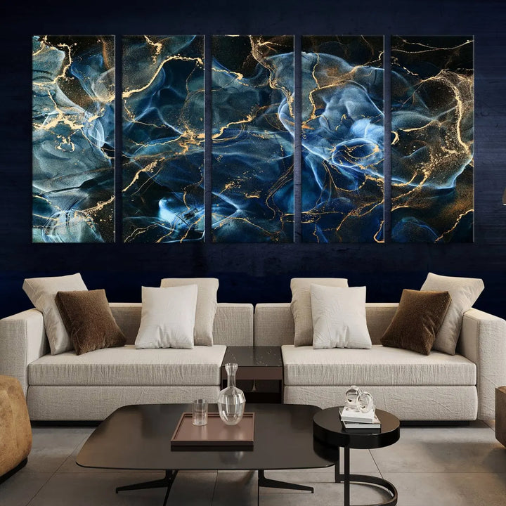 The Navy Blue and Smokey Marble Fluid Effect Abstract Canvas Wall Art Print features a swirling blue and gold pattern in a gallery-wrapped, museum-quality design.