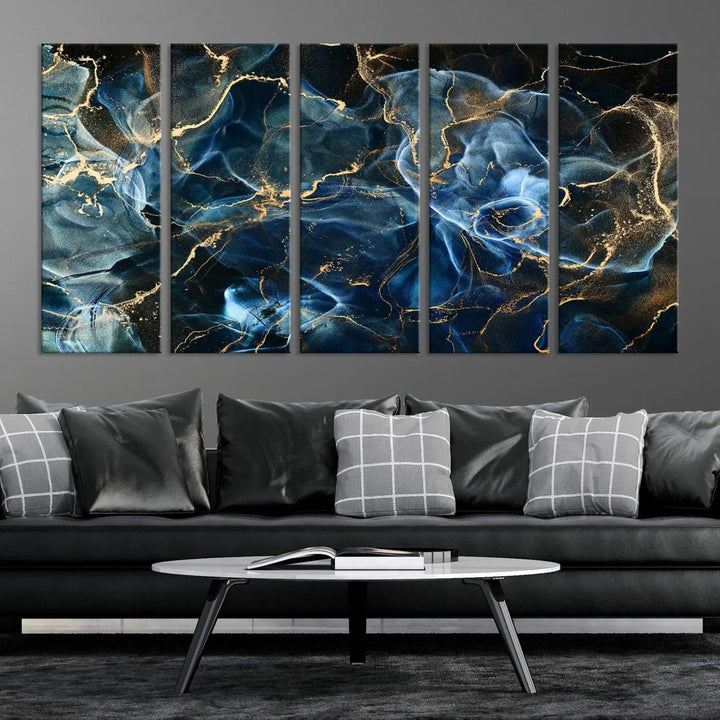 The Navy Blue and Smokey Marble Fluid Effect Abstract Canvas Wall Art Print features a swirling blue and gold pattern in a gallery-wrapped, museum-quality design.