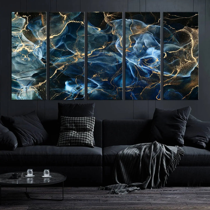 The Navy Blue and Smokey Marble Fluid Effect Abstract Canvas Wall Art Print features a swirling blue and gold pattern in a gallery-wrapped, museum-quality design.