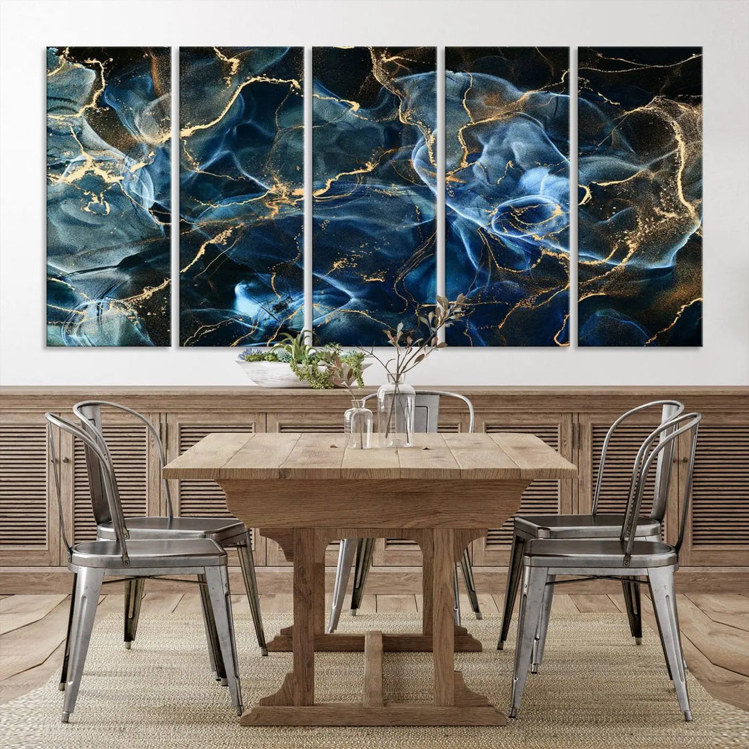 The Navy Blue and Smokey Marble Fluid Effect Abstract Canvas Wall Art Print features a swirling blue and gold pattern in a gallery-wrapped, museum-quality design.