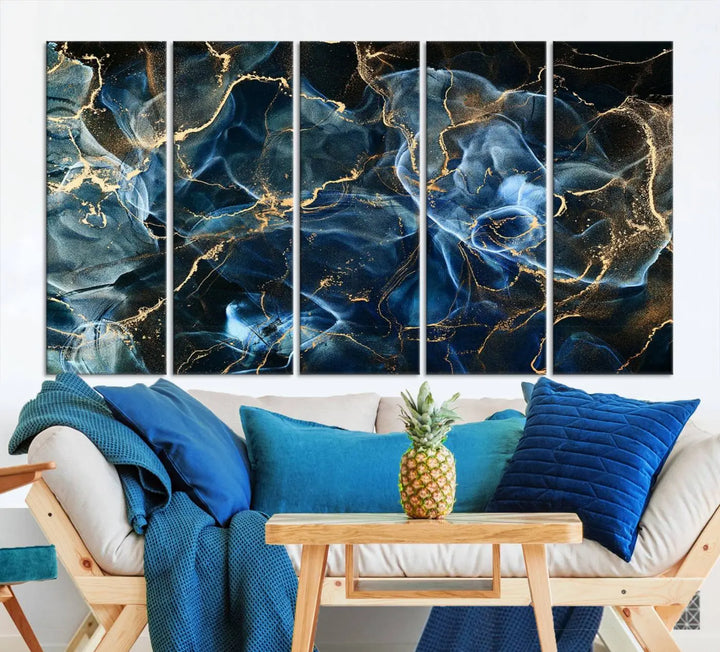 The Navy Blue and Smokey Marble Fluid Effect Abstract Canvas Wall Art Print features a swirling blue and gold pattern in a gallery-wrapped, museum-quality design.