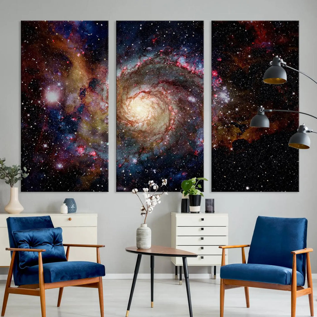 The modern living room is adorned with the Nebula and Galaxies in Space Wall Art, a spiral galaxy canvas print that showcases high-resolution details on museum-quality canvas. The UV-protective coating ensures its stunning allure is preserved.