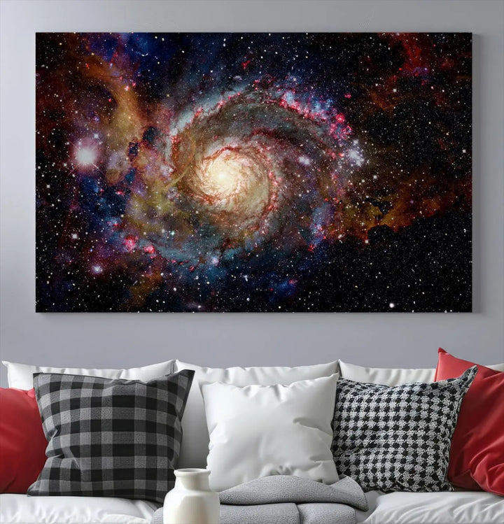 The modern living room is adorned with the Nebula and Galaxies in Space Wall Art, a spiral galaxy canvas print that showcases high-resolution details on museum-quality canvas. The UV-protective coating ensures its stunning allure is preserved.