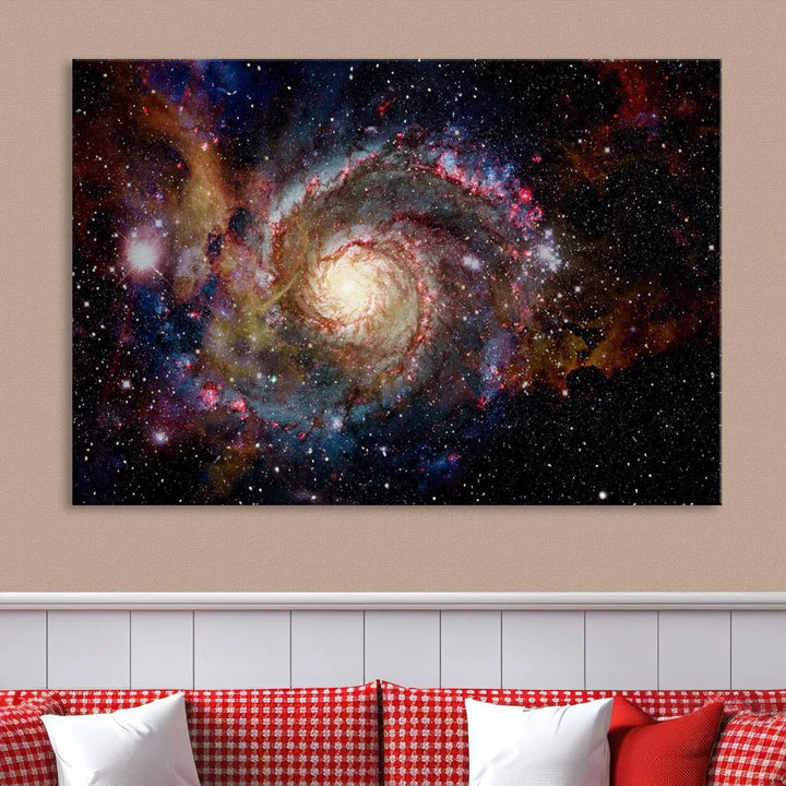 The modern living room is adorned with the Nebula and Galaxies in Space Wall Art, a spiral galaxy canvas print that showcases high-resolution details on museum-quality canvas. The UV-protective coating ensures its stunning allure is preserved.