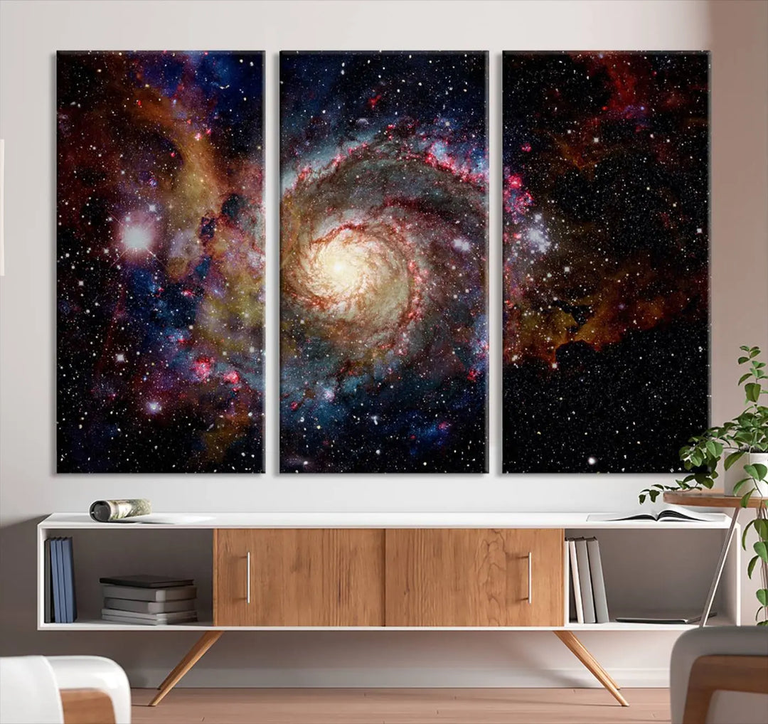 The modern living room is adorned with the Nebula and Galaxies in Space Wall Art, a spiral galaxy canvas print that showcases high-resolution details on museum-quality canvas. The UV-protective coating ensures its stunning allure is preserved.