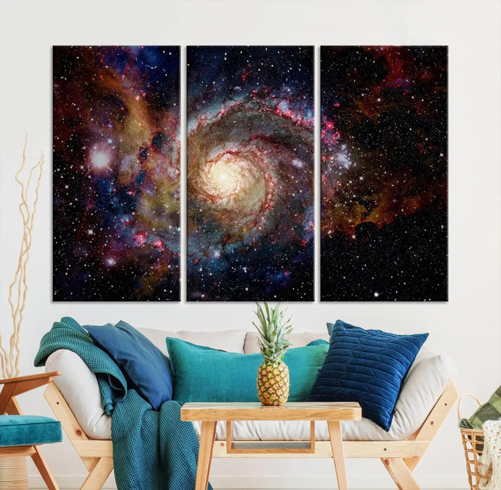 The modern living room is adorned with the Nebula and Galaxies in Space Wall Art, a spiral galaxy canvas print that showcases high-resolution details on museum-quality canvas. The UV-protective coating ensures its stunning allure is preserved.