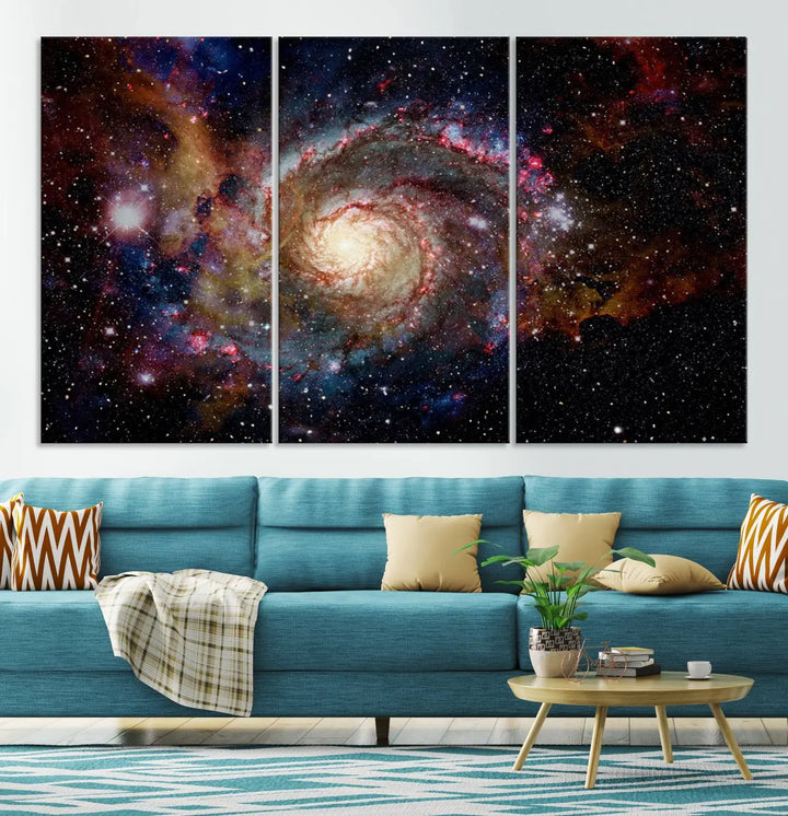 The modern living room is adorned with the Nebula and Galaxies in Space Wall Art, a spiral galaxy canvas print that showcases high-resolution details on museum-quality canvas. The UV-protective coating ensures its stunning allure is preserved.