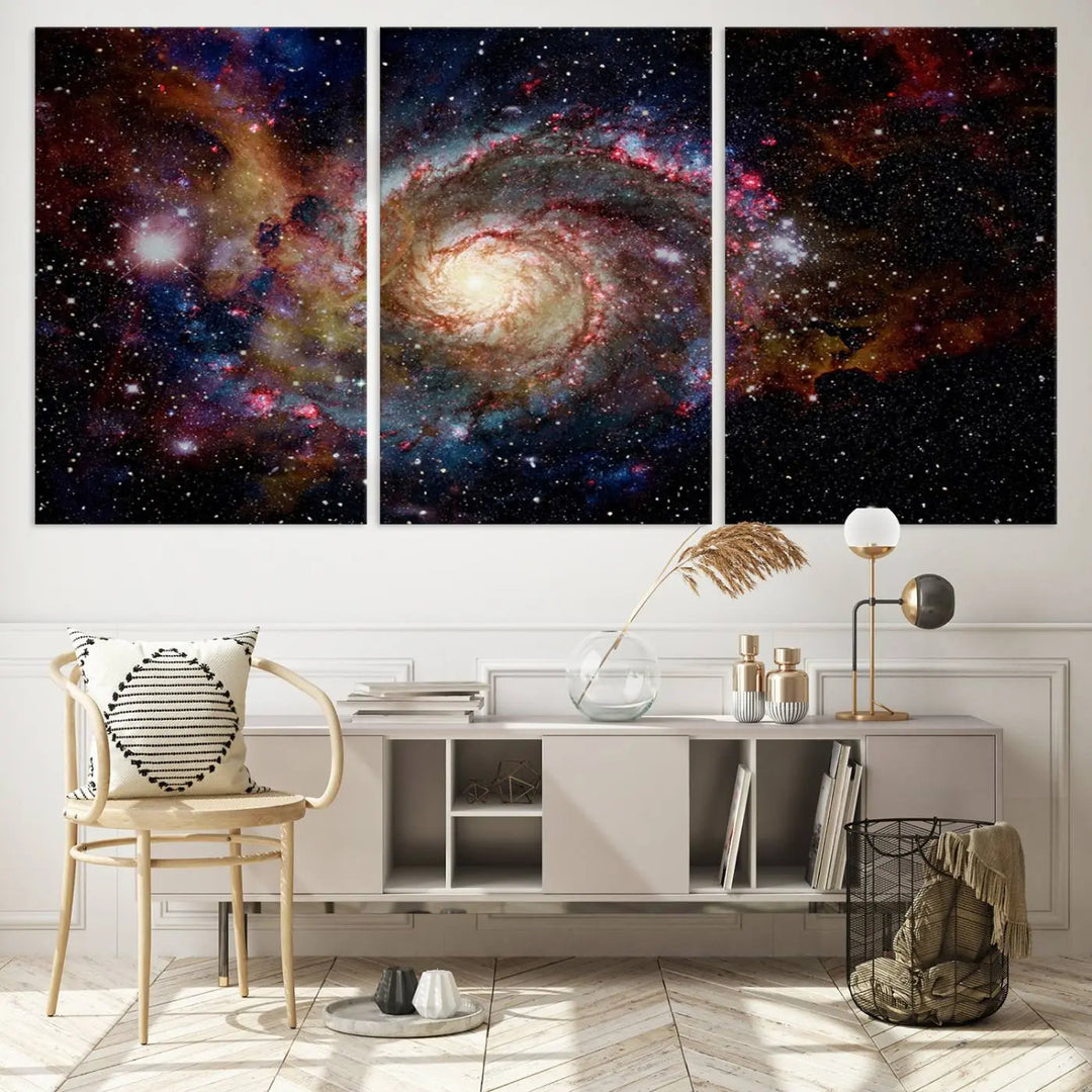 The modern living room is adorned with the Nebula and Galaxies in Space Wall Art, a spiral galaxy canvas print that showcases high-resolution details on museum-quality canvas. The UV-protective coating ensures its stunning allure is preserved.