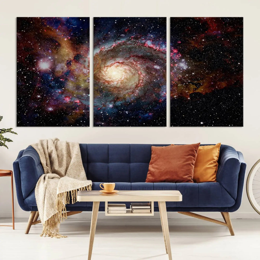 The modern living room is adorned with the Nebula and Galaxies in Space Wall Art, a spiral galaxy canvas print that showcases high-resolution details on museum-quality canvas. The UV-protective coating ensures its stunning allure is preserved.