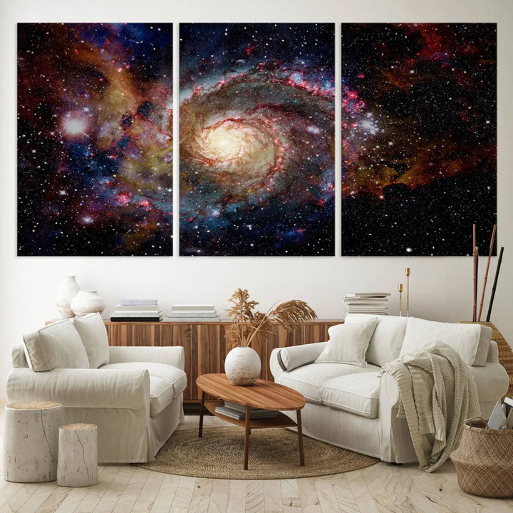 The modern living room is adorned with the Nebula and Galaxies in Space Wall Art, a spiral galaxy canvas print that showcases high-resolution details on museum-quality canvas. The UV-protective coating ensures its stunning allure is preserved.