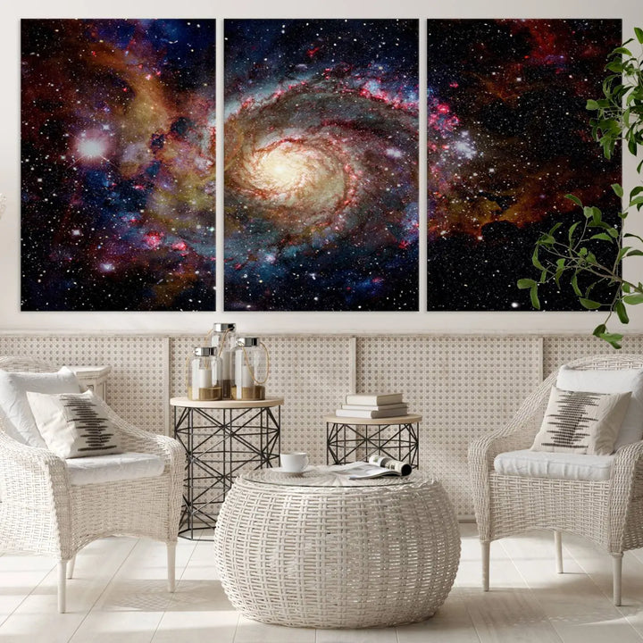 The modern living room is adorned with the Nebula and Galaxies in Space Wall Art, a spiral galaxy canvas print that showcases high-resolution details on museum-quality canvas. The UV-protective coating ensures its stunning allure is preserved.