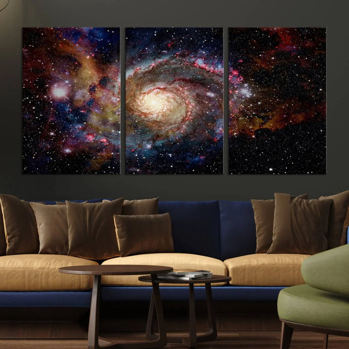 The modern living room is adorned with the Nebula and Galaxies in Space Wall Art, a spiral galaxy canvas print that showcases high-resolution details on museum-quality canvas. The UV-protective coating ensures its stunning allure is preserved.