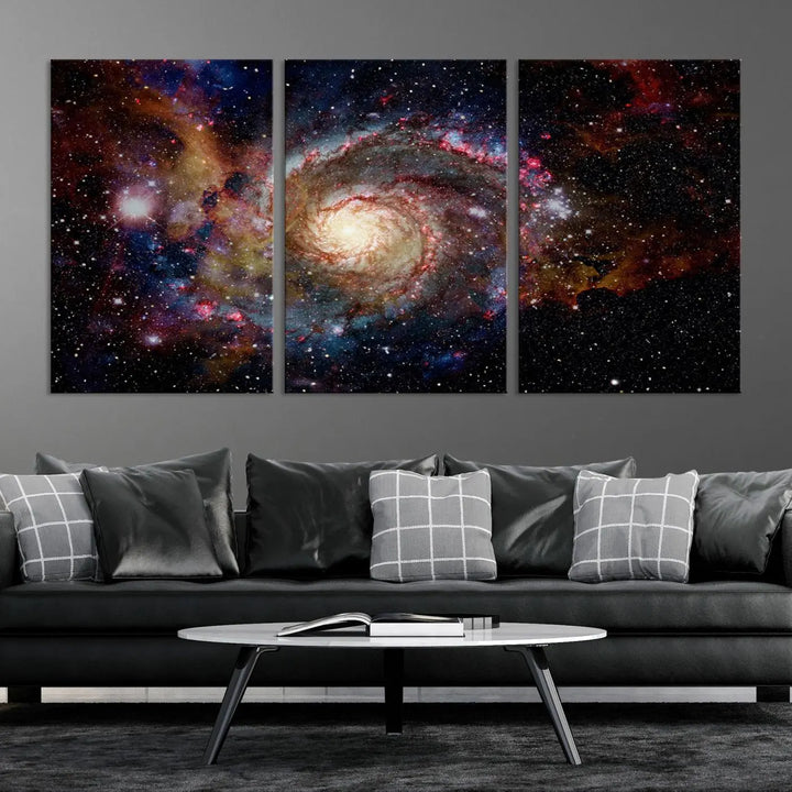 The modern living room is adorned with the Nebula and Galaxies in Space Wall Art, a spiral galaxy canvas print that showcases high-resolution details on museum-quality canvas. The UV-protective coating ensures its stunning allure is preserved.