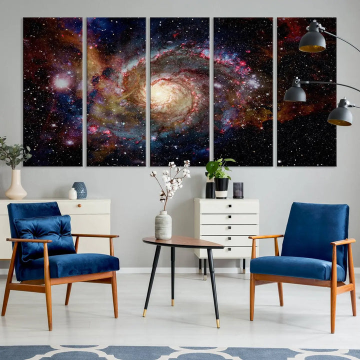 The modern living room is adorned with the Nebula and Galaxies in Space Wall Art, a spiral galaxy canvas print that showcases high-resolution details on museum-quality canvas. The UV-protective coating ensures its stunning allure is preserved.