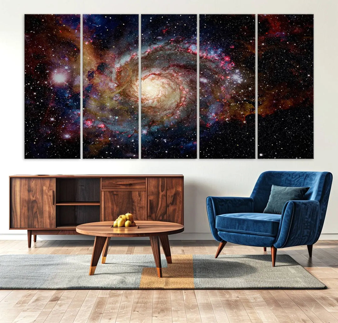 The modern living room is adorned with the Nebula and Galaxies in Space Wall Art, a spiral galaxy canvas print that showcases high-resolution details on museum-quality canvas. The UV-protective coating ensures its stunning allure is preserved.